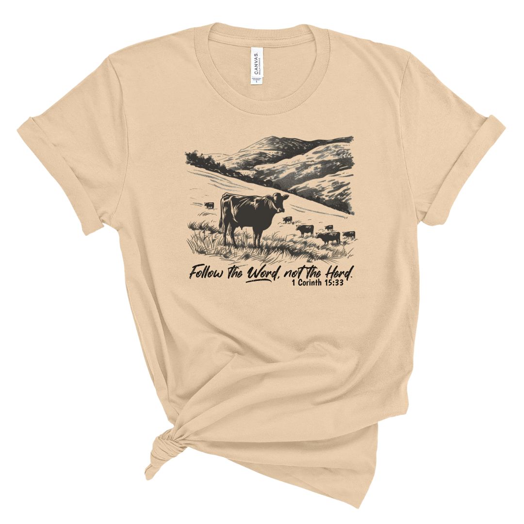 Shirt that says follow the word not the herd from 1 Corinthians 15:33 and features a hill landscape with cows