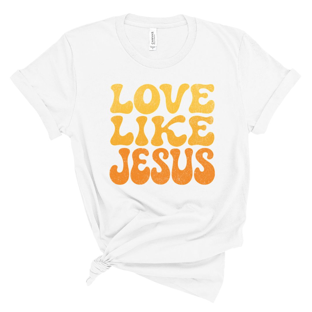 White t-shirt with 'Love Like Jesus' text in orange on a white background