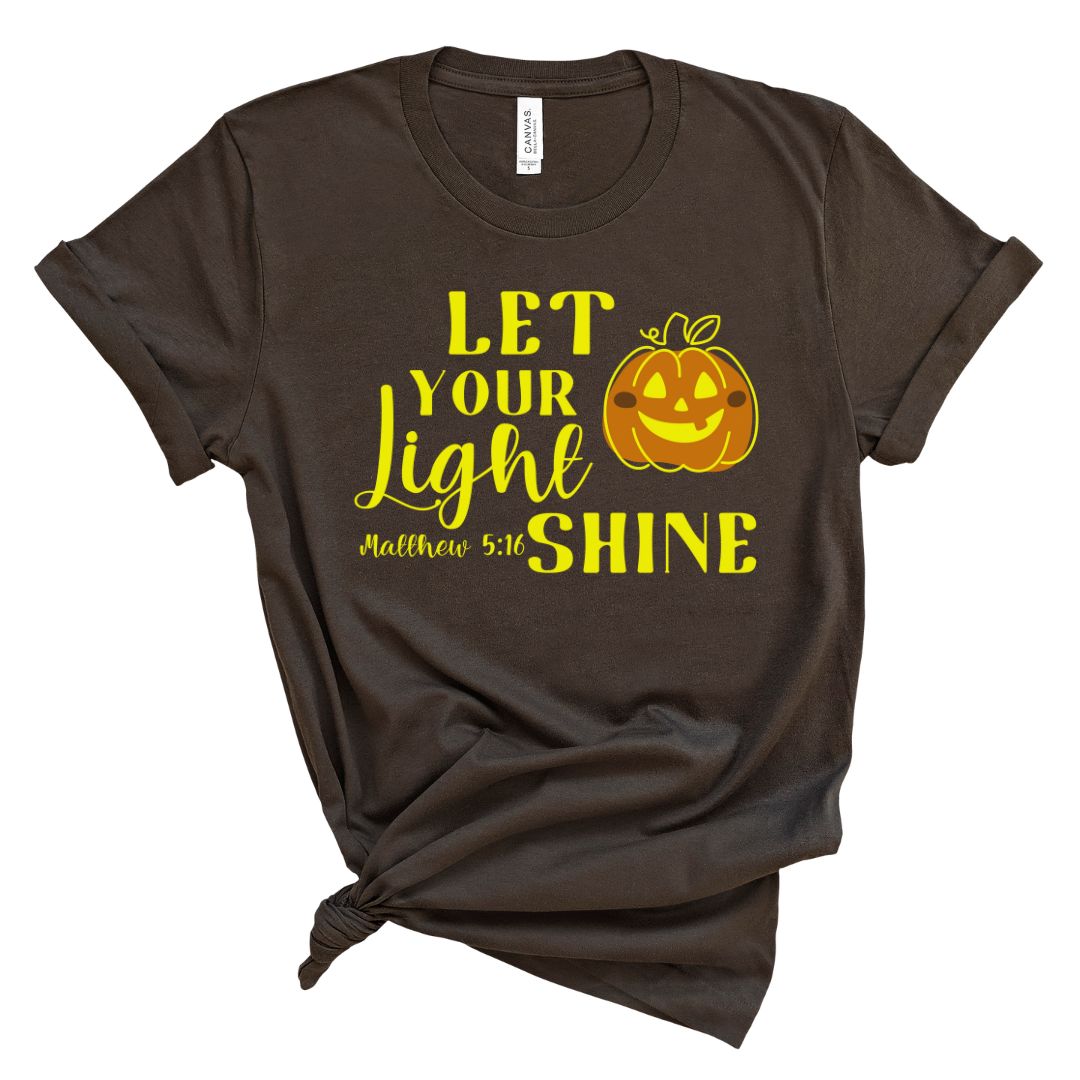 Dark shirt with the text Let your Light Shine Matthew 5:16 featuring a fall Halloween pumpkin