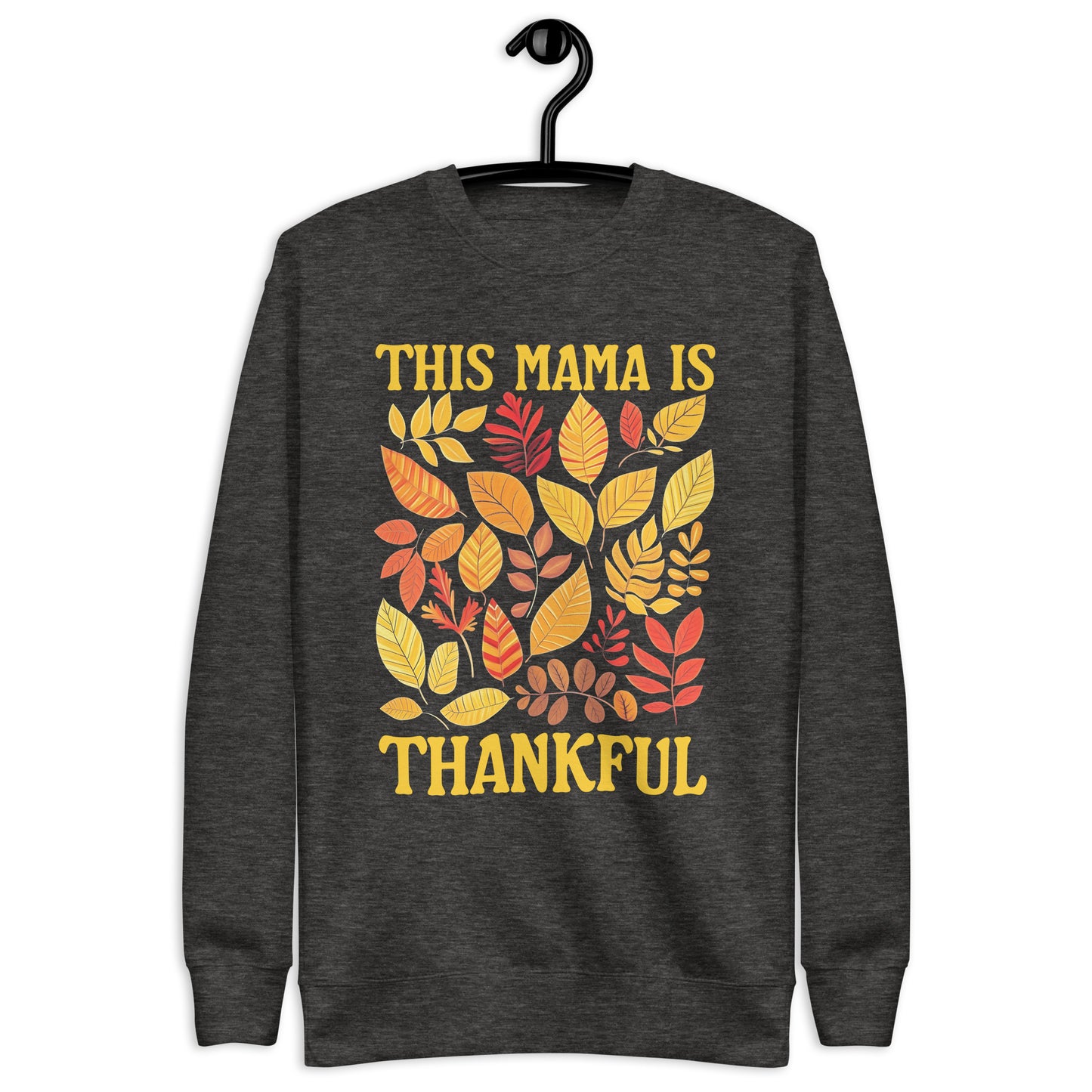 A gray sweatshirt with a fall-themed design featuring leaves and the text 'This Mama is Thankful' in yellow.
