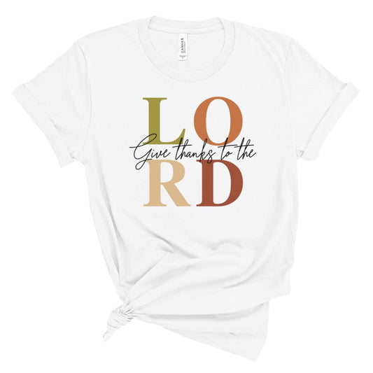White t-shirt with 'Give thanks to the LORD' text in colorful letters on a white background