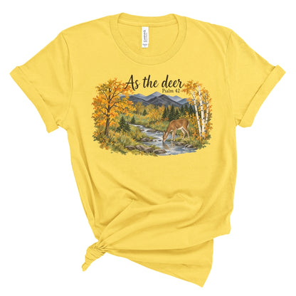 shirt with a watercolor style deer drinking from a creek, golden fall trees, evergreens, and mountains beneath “As the deer” and “Psalm 42.”