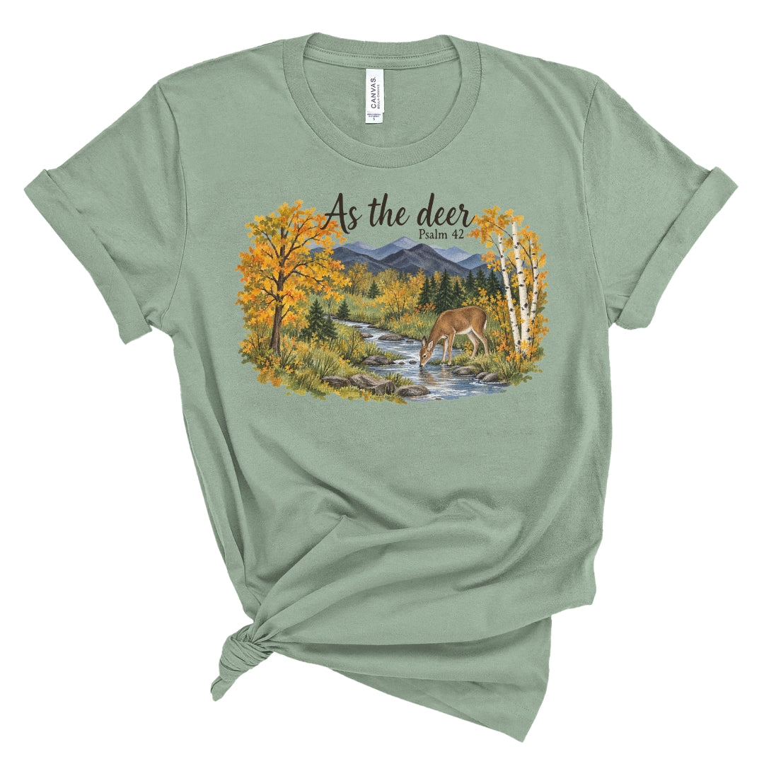shirt with a watercolor style deer drinking from a creek, golden fall trees, evergreens, and mountains beneath “As the deer” and “Psalm 42.”