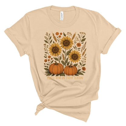 Beige t-shirt with sunflowers and pumpkins design on a white background