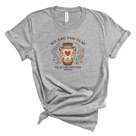 Christian shirt for women with pottery illustration and the words We Are the Clay He Is the Potter featuring Isaiah 64:8.
