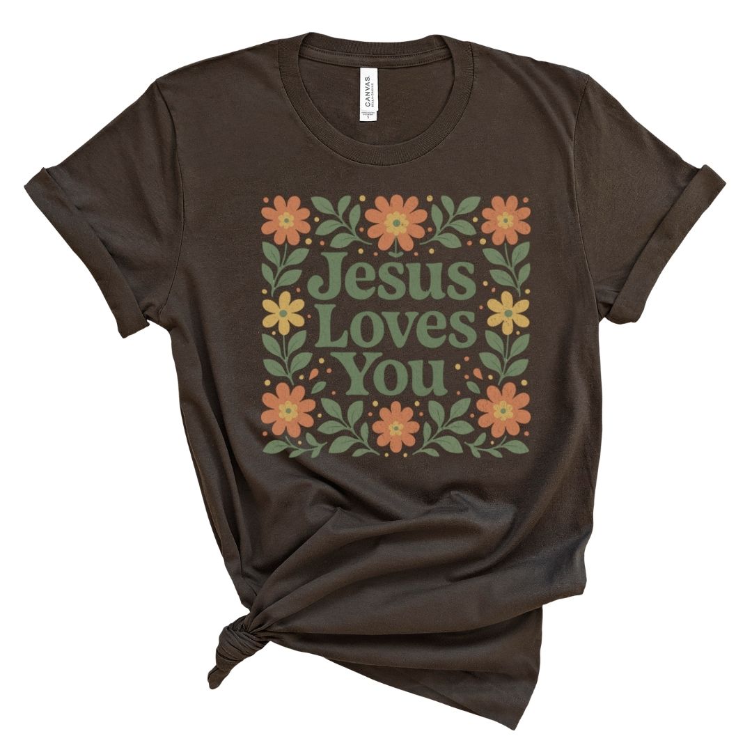 Christian shirt for women with floral folk-style lettering that reads Jesus Loves You.