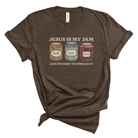 Brown Christian shirt for women with three illustrated jam jars labeled faith, hope, and love, with text “Jesus is my jam – I’m here to spread it.”