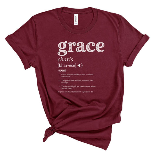 Maroon t-shirt with white text and the definition of grace