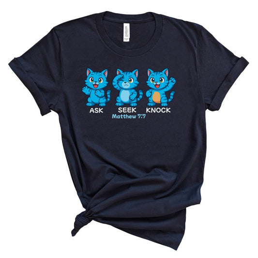 Navy blue t-shirt with cartoon cats and text that says ask, seek, knock in anime style