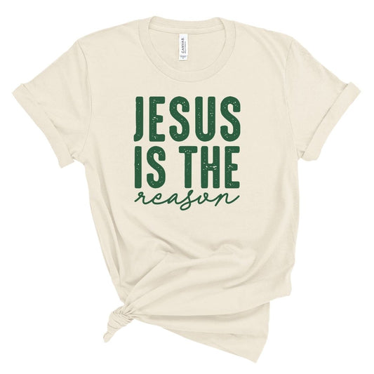 Beige t-shirt with 'Jesus is the reason' text in green on a white background