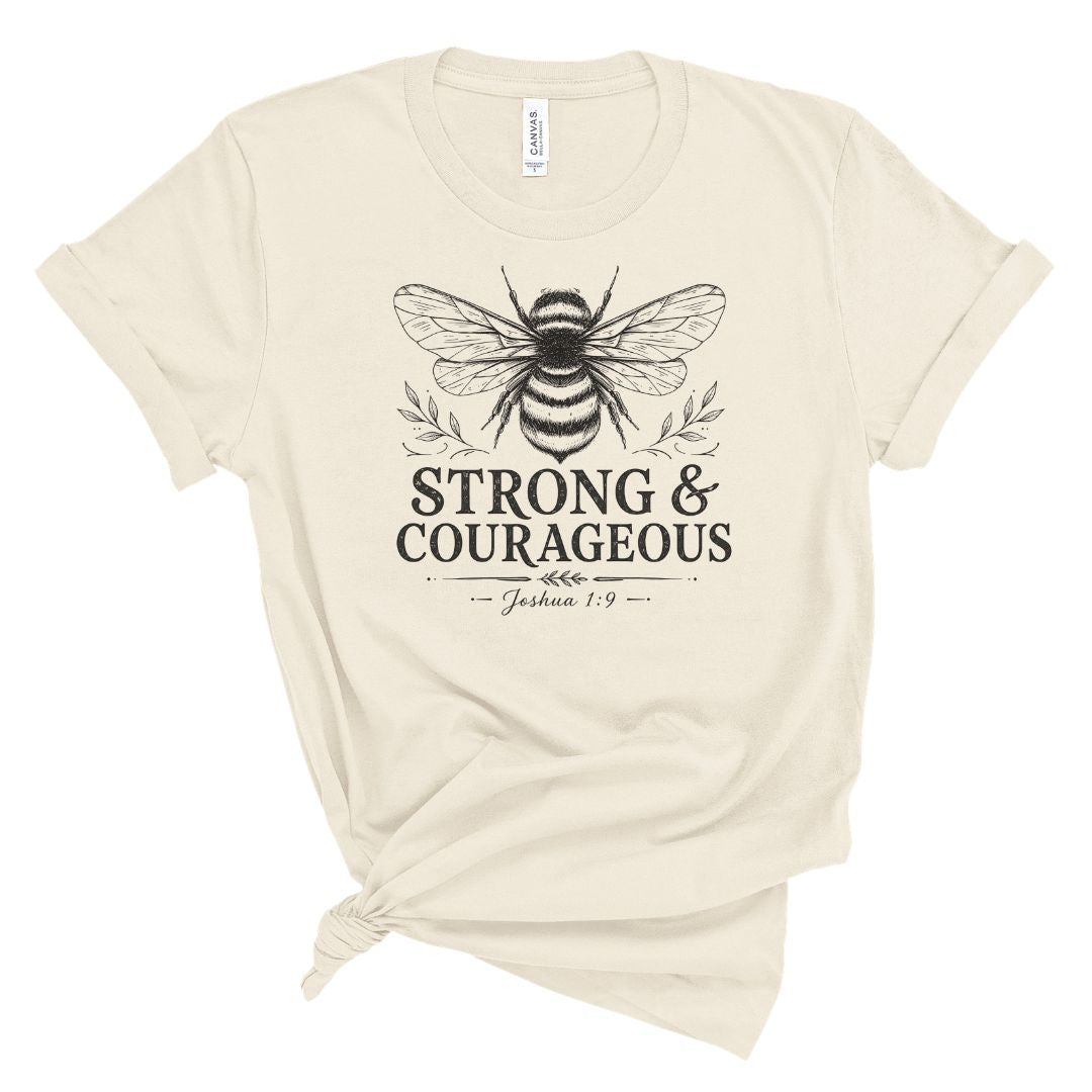 Christian t shirt featuring a vintage bee illustration and the words Strong & Courageous with Joshua 1:9. Faith based shirt for women inspired by the Bible verse about courage and God's presence.
