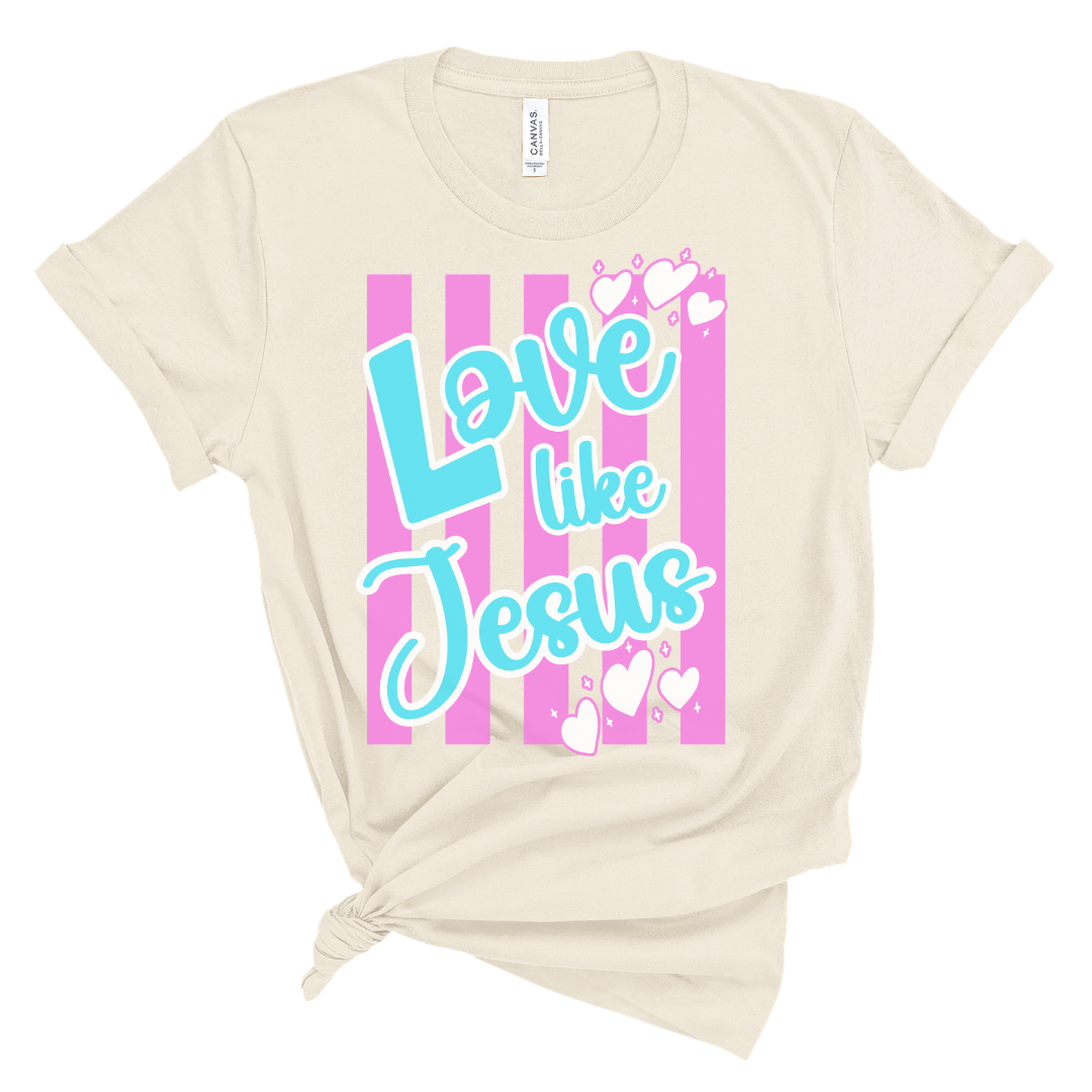 Christian t-shirt with “Love Like Jesus” text, heart accents, bright striped background, faith-based shirt for women