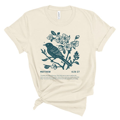 Christian t shirt for women with teal bird and blossoms illustration and Matthew 6:26-27 Bible verse about considering the birds.