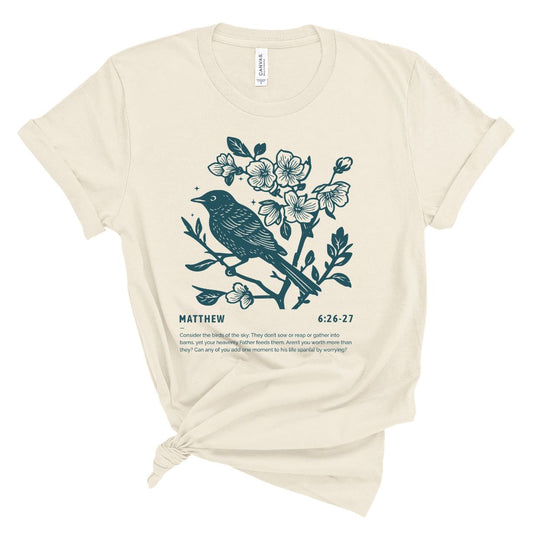 Christian t shirt for women with teal bird and blossoms illustration and Matthew 6:26-27 Bible verse about considering the birds.