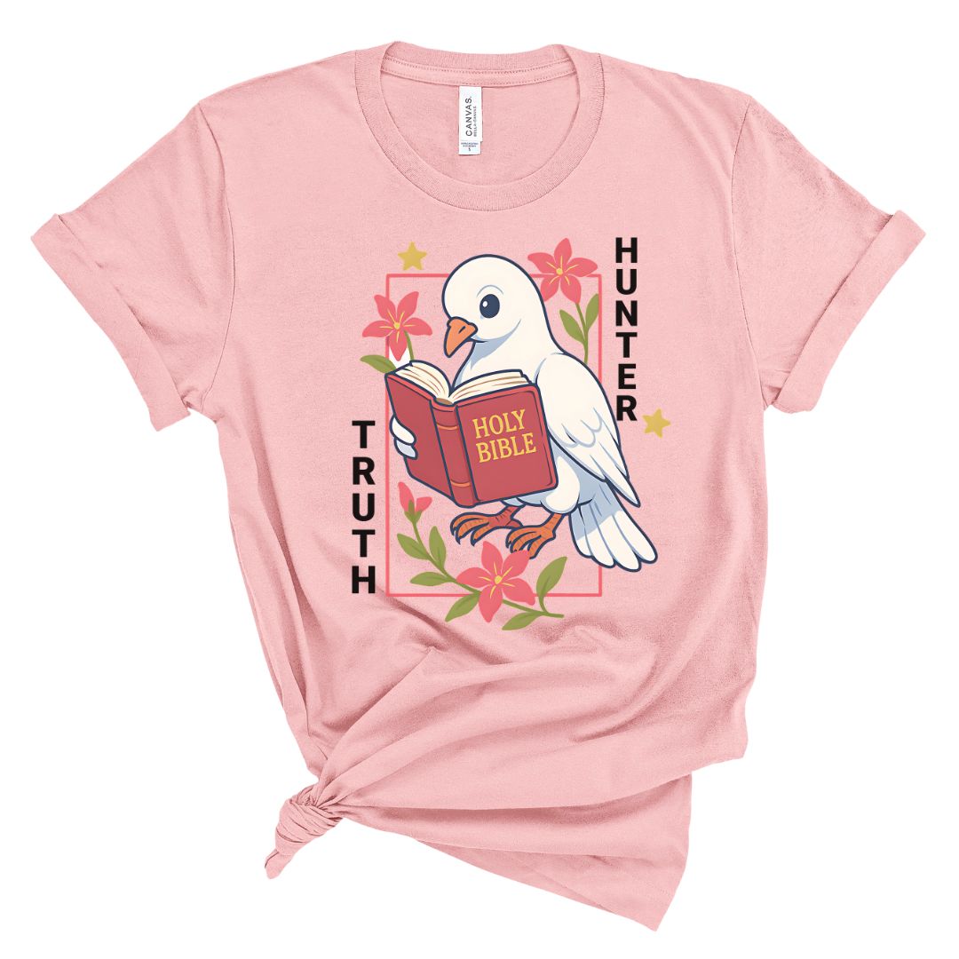 Pink t-shirt with a dove holding a Bible and floral design on a white background