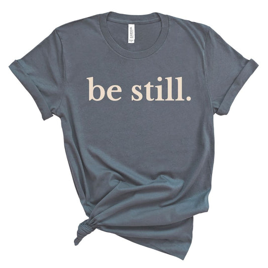 Blue t-shirt with 'be still.' text 