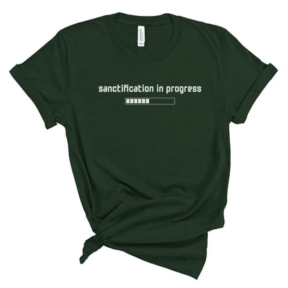 Christian t shirt for women with “Sanctification in progress” and loading bar graphic in white, minimalist Bible based shirt for moms.