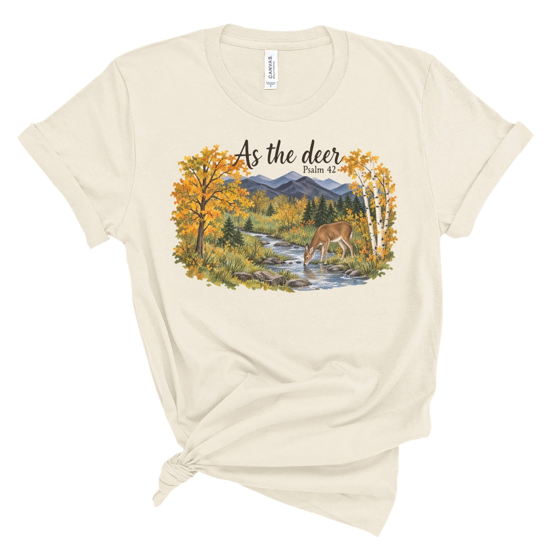 shirt with a watercolor style deer drinking from a creek, golden fall trees, evergreens, and mountains beneath “As the deer” and “Psalm 42.”