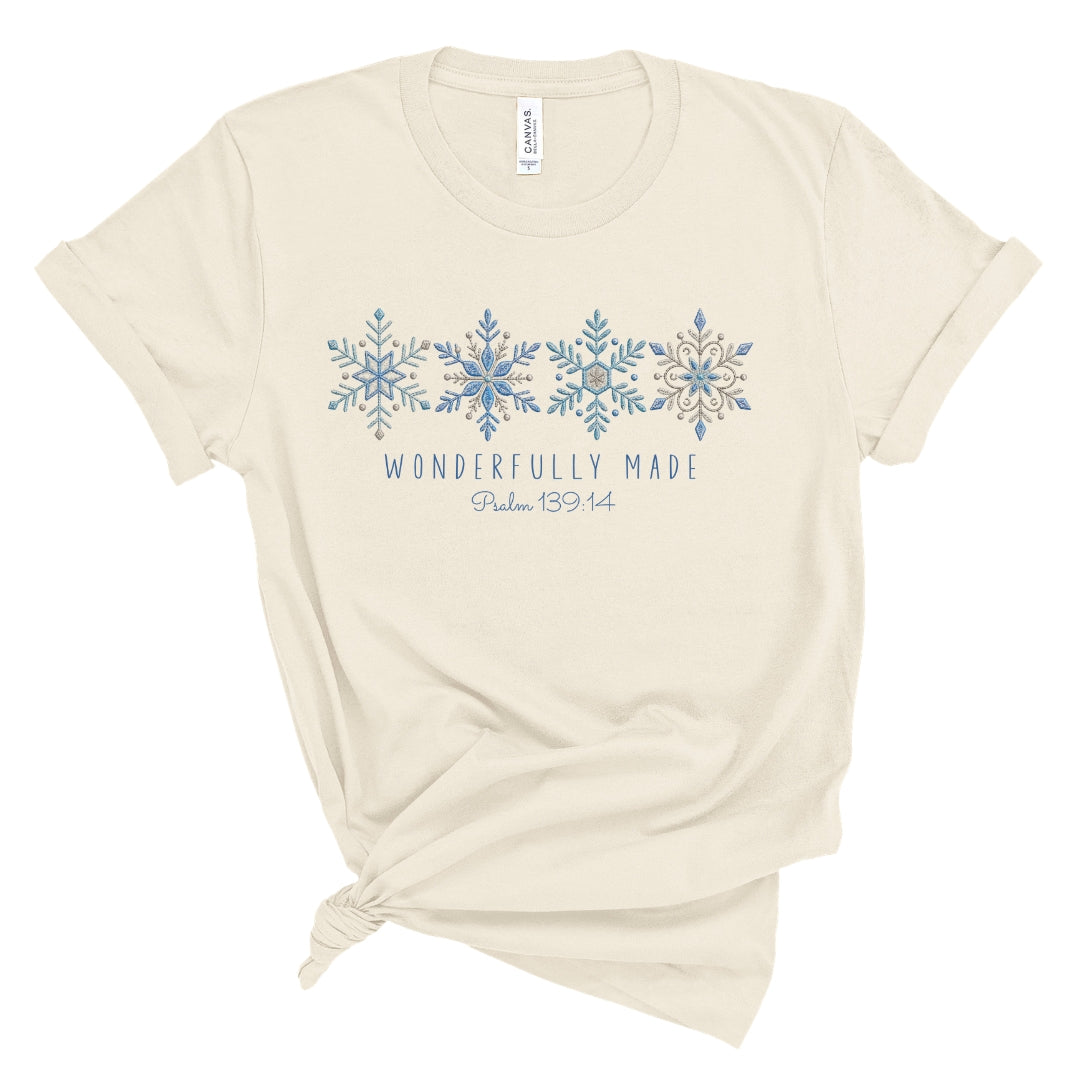 Christian tee with four detailed snowflakes in a blue printed faux embroidery style, with Wonderfully Made and Psalm 139:14 underneath.