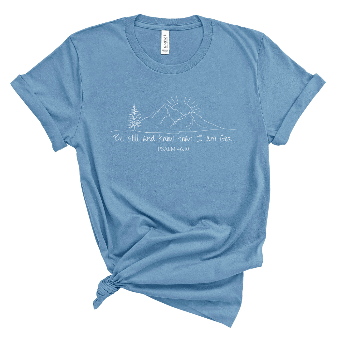 Christian t shirt for women with Psalm 46 10 Be still and know that I am God, mountain sunrise graphic design, faith based Bible verse tee for everyday wear