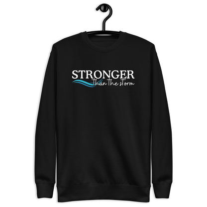 Sweatshirt with the text stronger than the storm and an image of a wave
