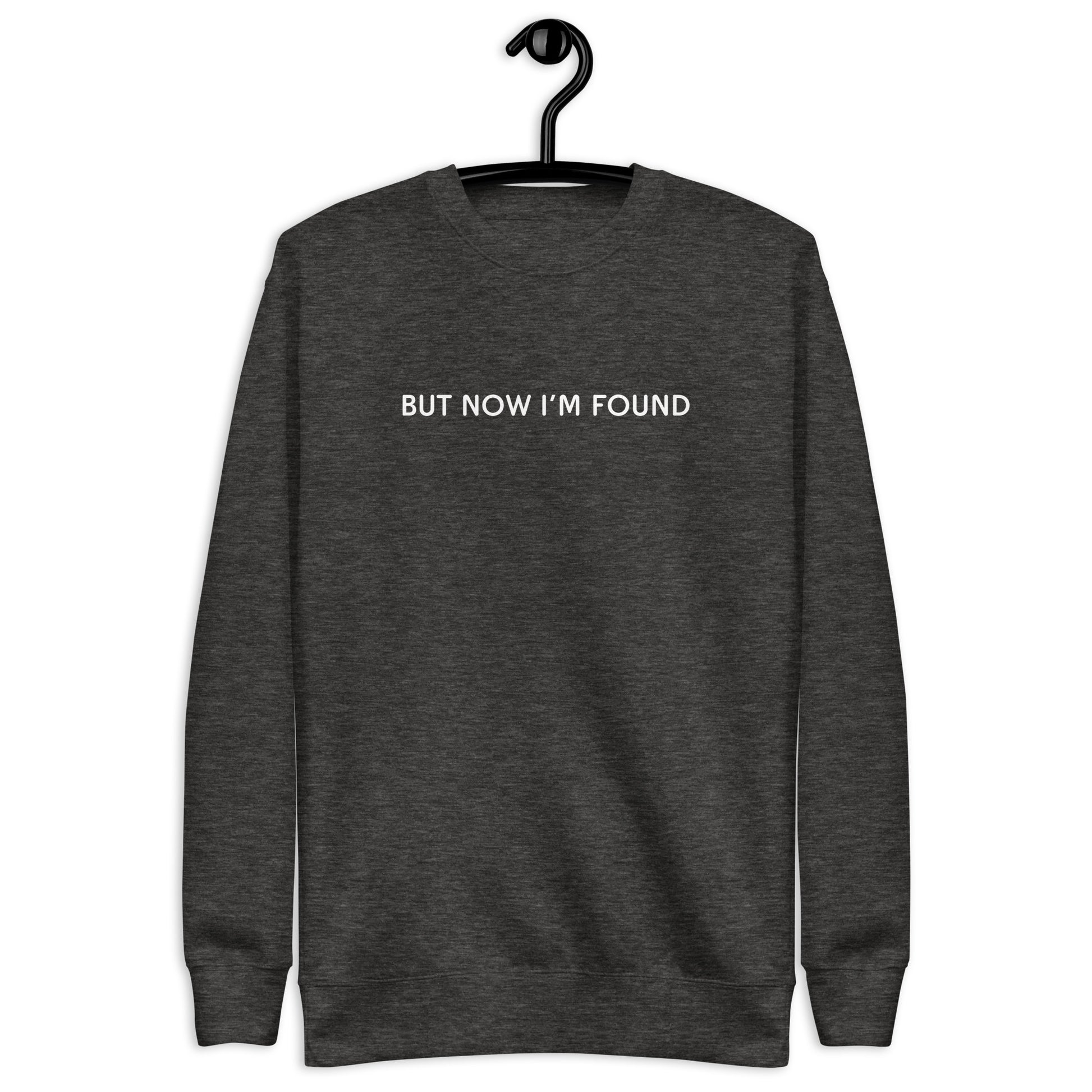 sweatshirt with the text But now I'm found in a simple minimalistic font