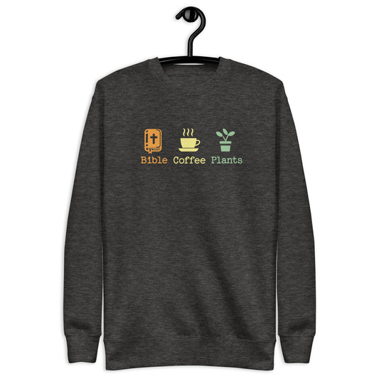 Sweatshirt that says Bible, Coffee, Plants and has images of a bible, coffee, and a plant