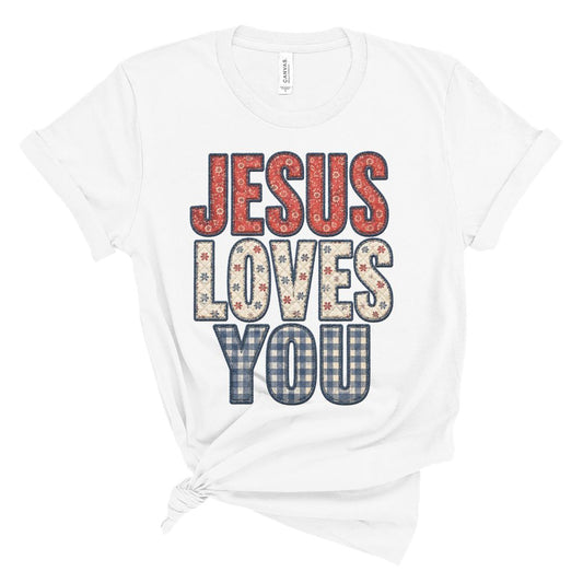 Christian summer shirt with faux embroidered Jesus Loves You text in red white and blue vintage floral and plaid pattern.