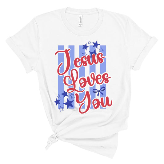 Christian women’s t shirt with colorful Jesus Loves You script lettering and blue striped patriotic background with stars.
